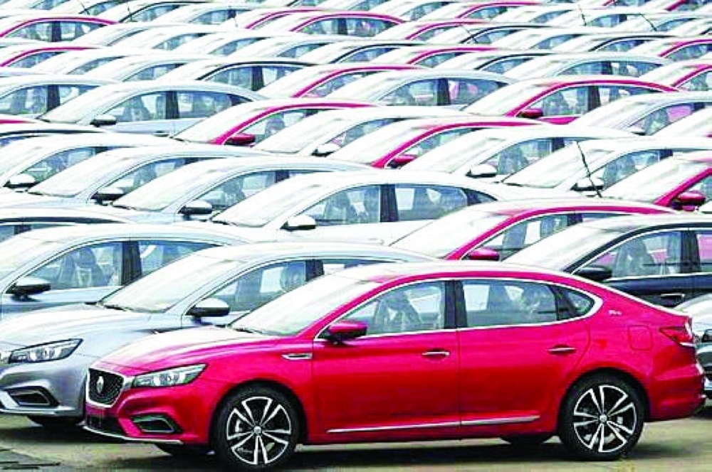 Cars for export wait to be loaded onto cargo vessels at a port in Lianyungang, Jiangsu province, China. — Reuters