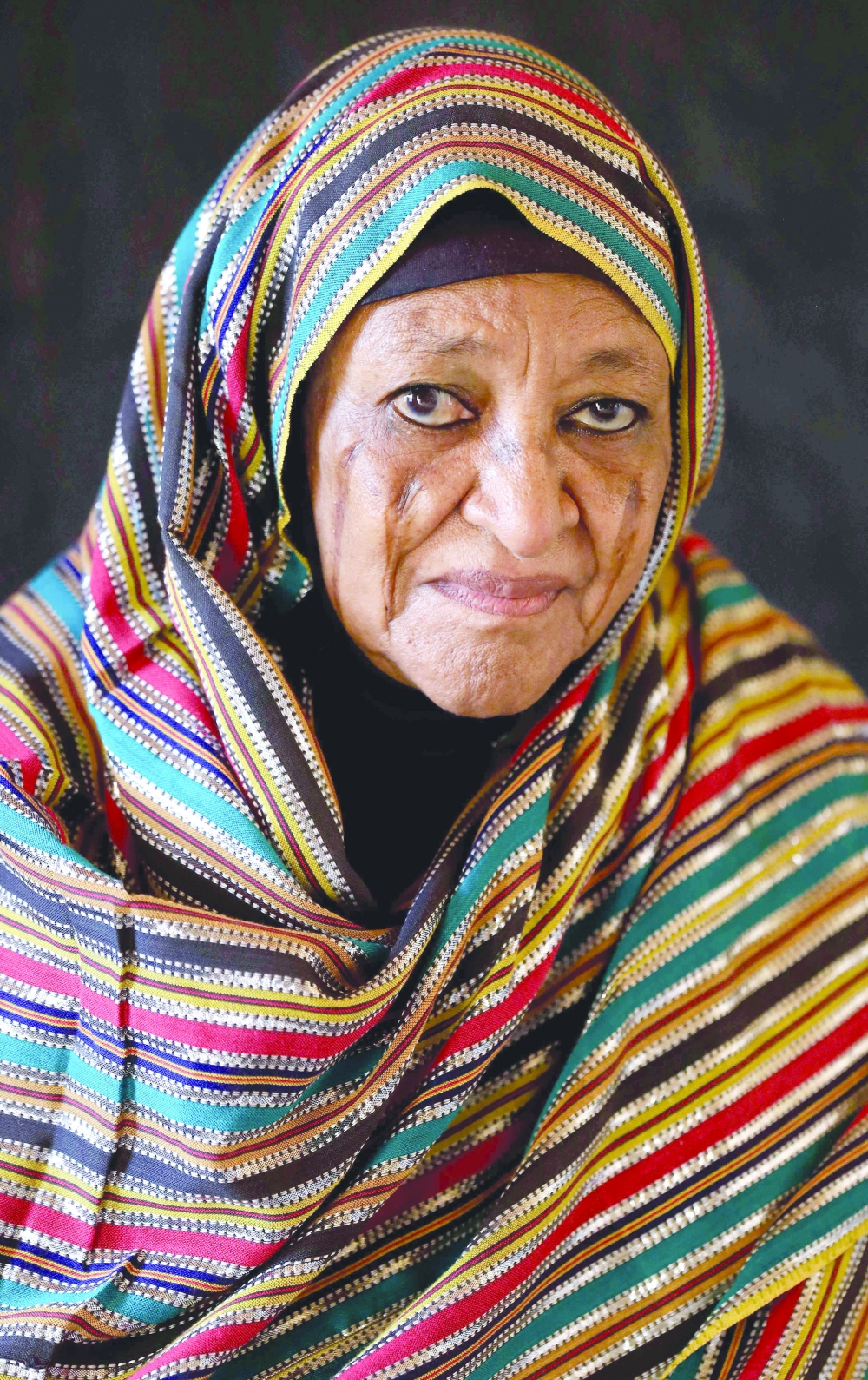 امرأة سودانية  تحمل ذات الندوب