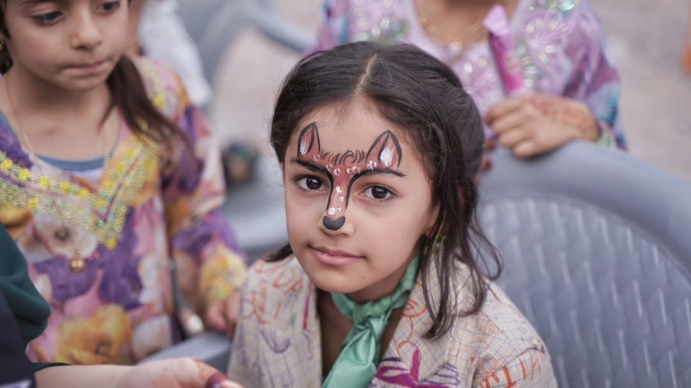 الرسم على وجوه الأطفال ضمن الفعالية بالعوابي 